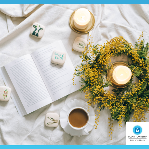 cup of coffee, candles and a book