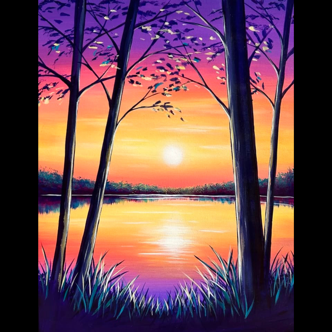 A sunset near a lake with trees